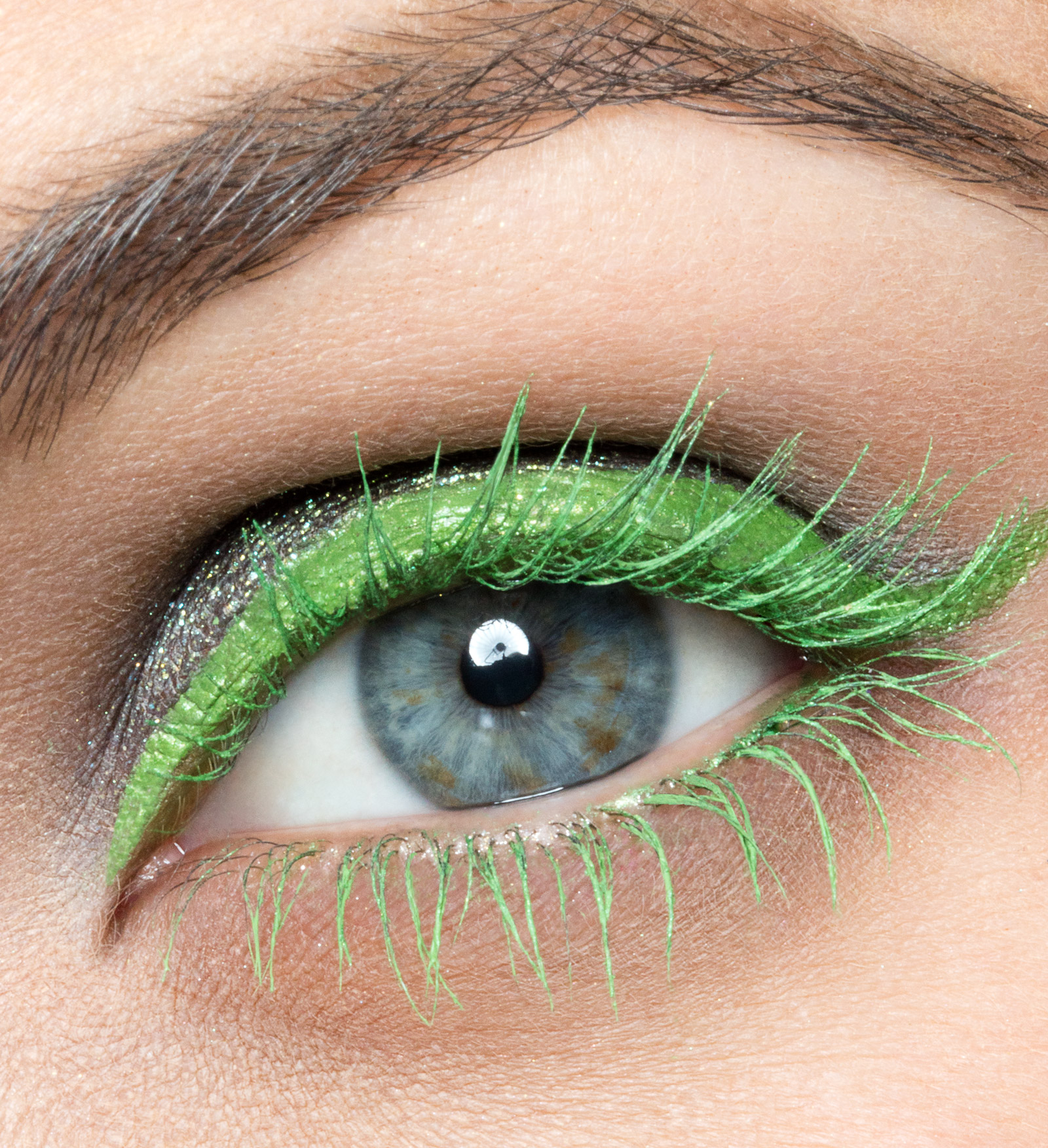 Macro beauty photograph of an Urban Decay mascara eye look in green