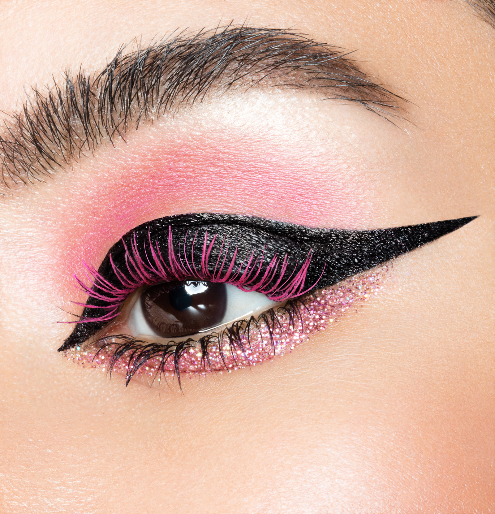 Macro beauty photograph of an Urban Decay mascara eye look in pink
