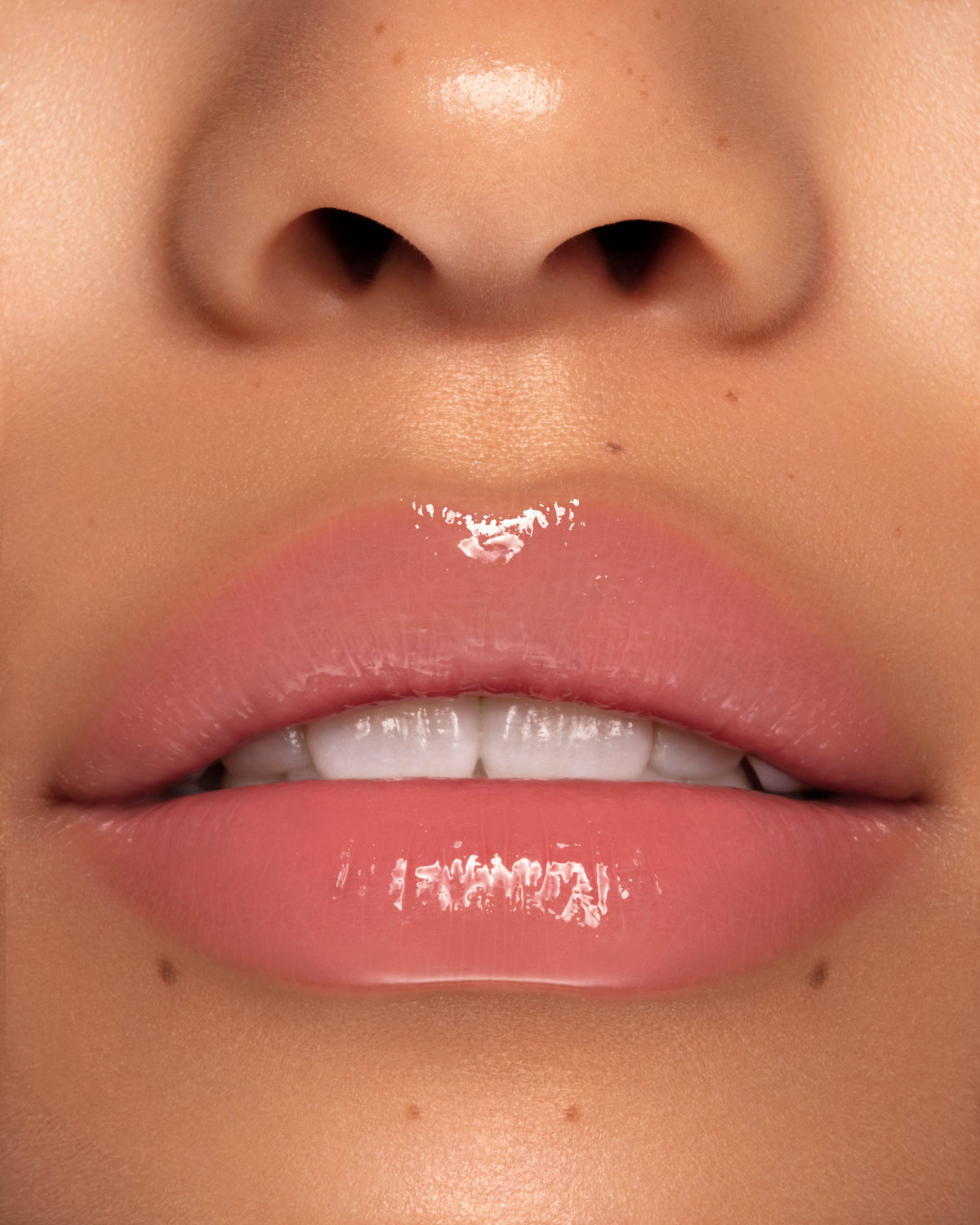 Beauty photograph of Pat McGrath Labs LUST: Gloss in Prima Donna, macro lip