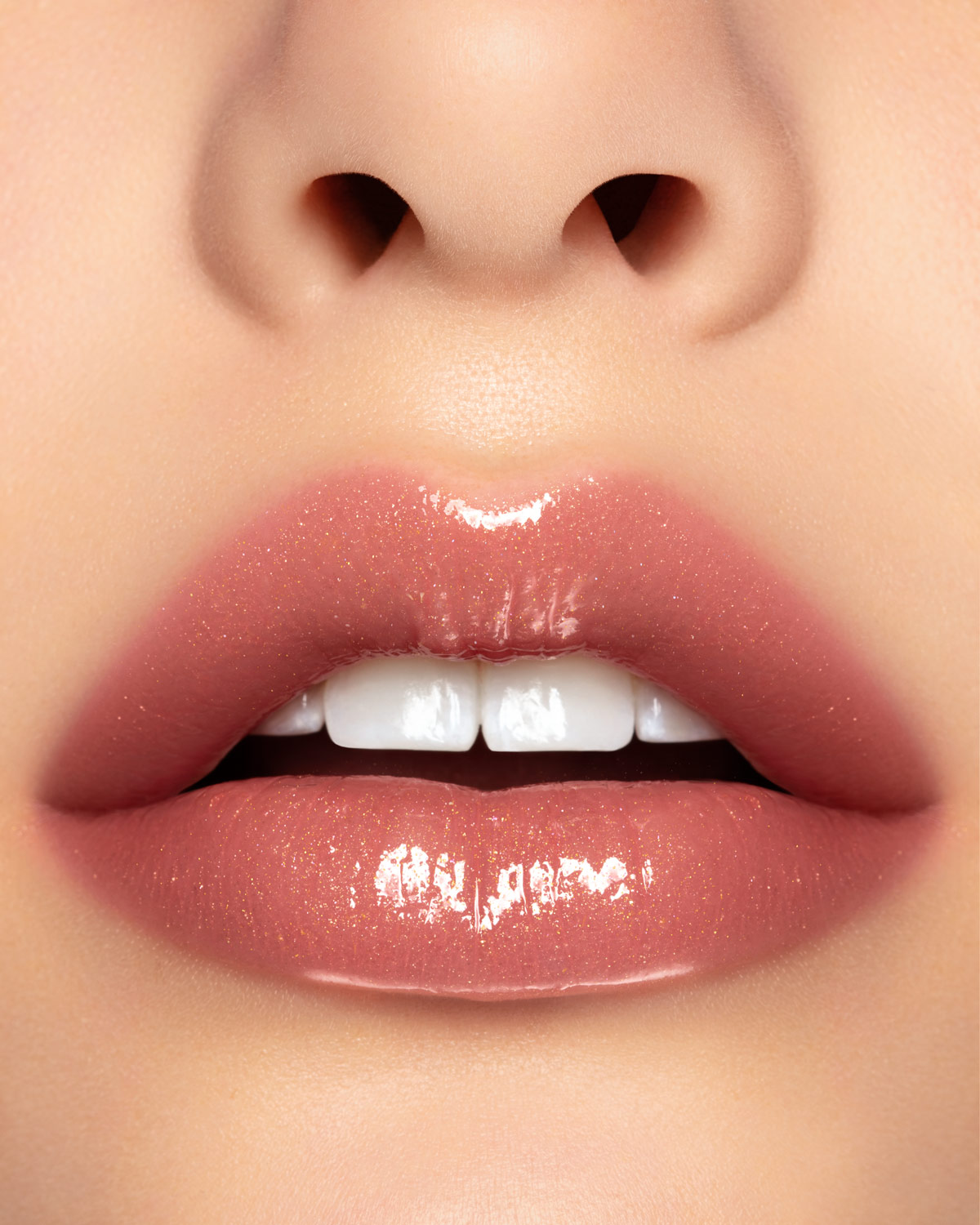 Beauty photograph of Pat McGrath Labs LUST: Gloss in Sunset Rose, macro lip